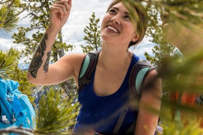 Student pointing at a tree