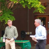 John Marzluff receiving award from Dan Brown