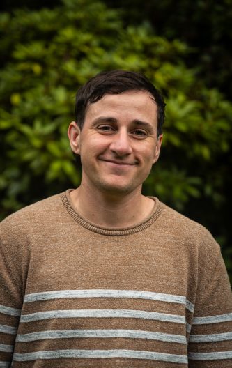 person near bushes