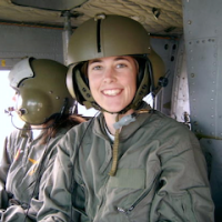 Alicia Sullivan in safety gear in a helicopter.
