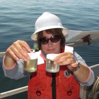 Vera Trainer sampling an algal bloom